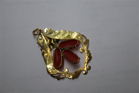A 14k yellow metal and coral set drop pendant, 44mm.